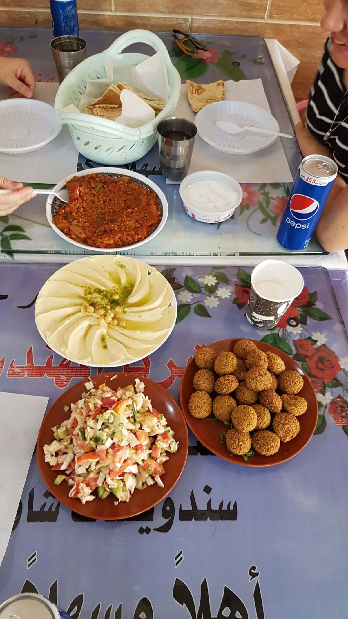 the first encounter with a Jordanian food - hummus, falafel and some lamb meat in vegetable spicy sauce (I have no idea about of